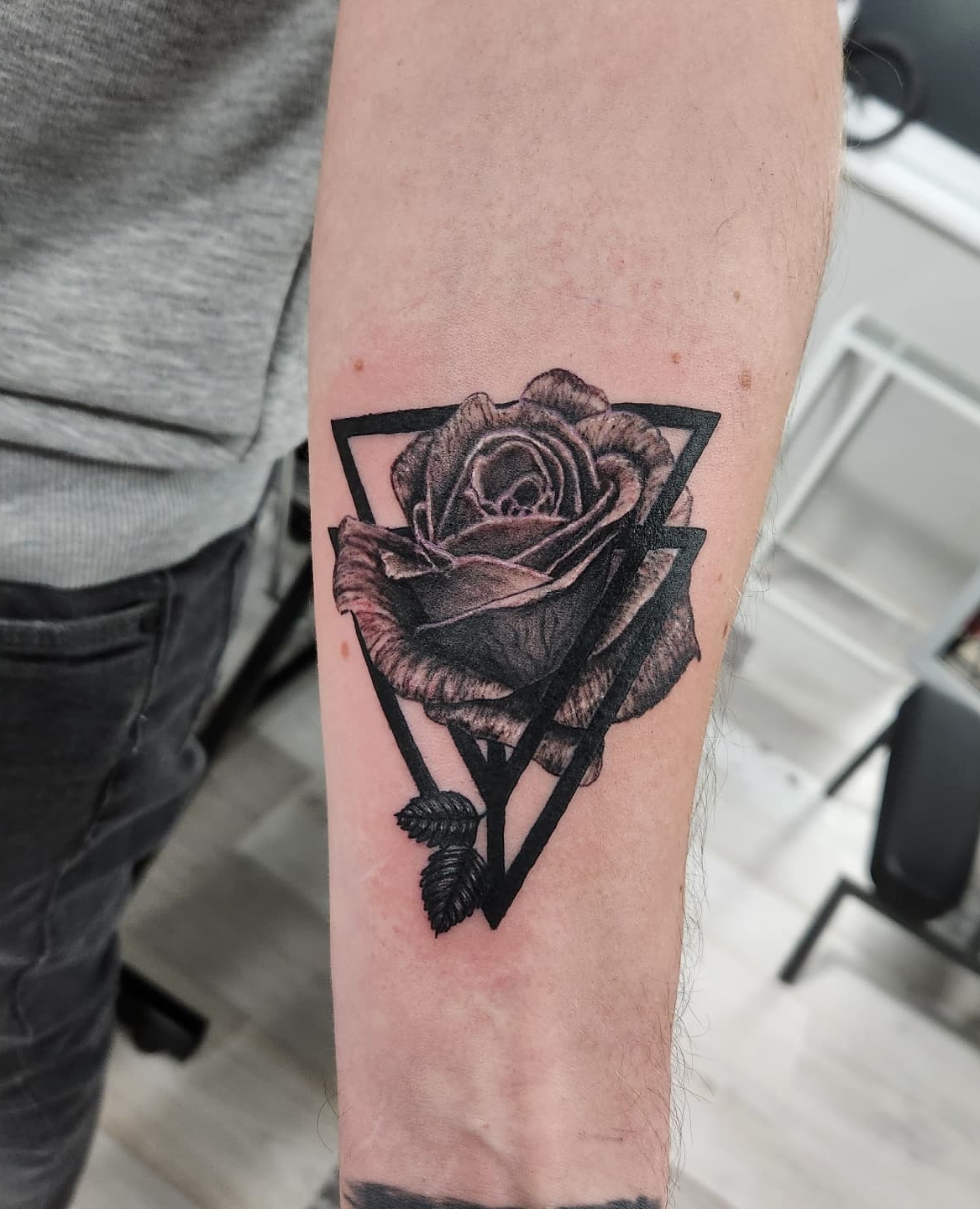 Black Rose in Geometric Figure on Arm